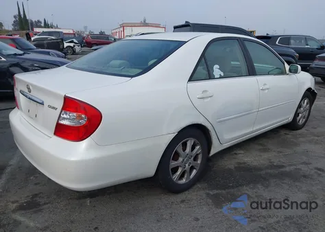 2004 Toyota Camry Le z USA, uszkodzony, nr VIN JTDBE32K840269220